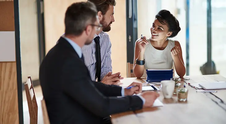 Shot of office workers in a meeting in a boardroom